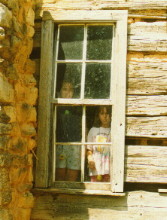 Adams kids watching from a window.